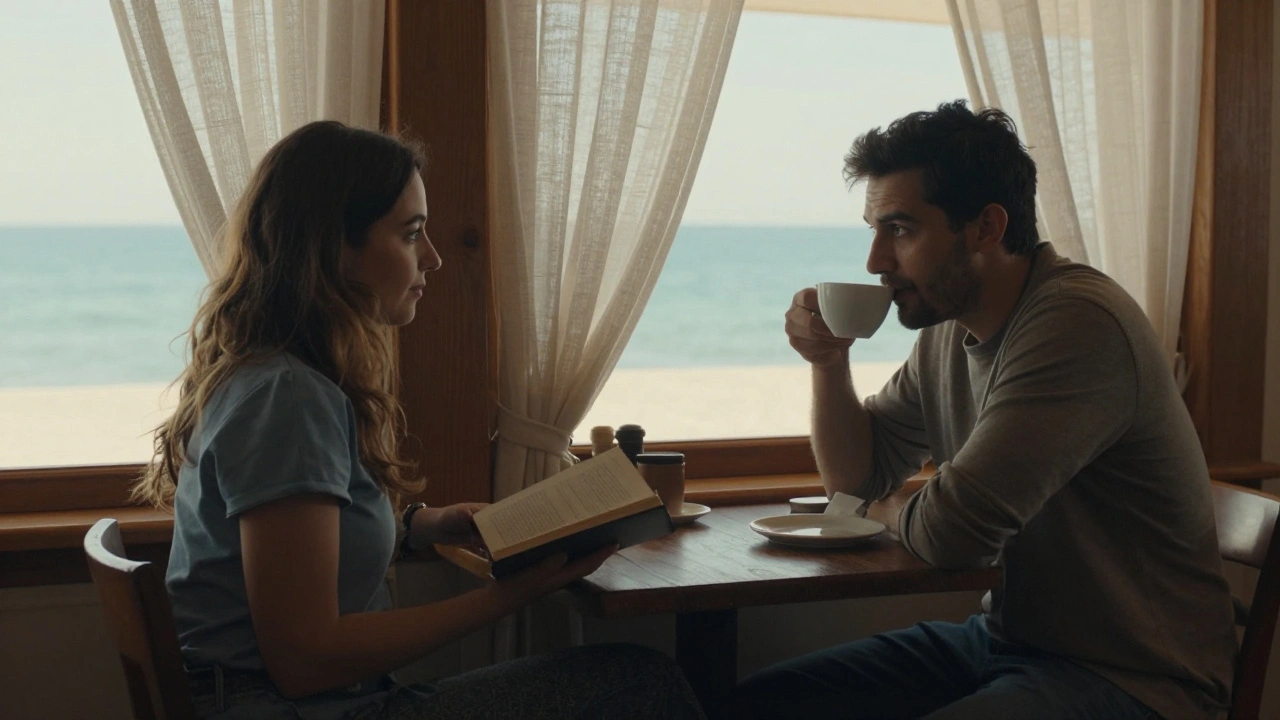 Kumburgaz'da küçük bir kafede, bir kadın kitap okurken bir erkek kahve içiyor, sessiz bir an paylaşıyor.
